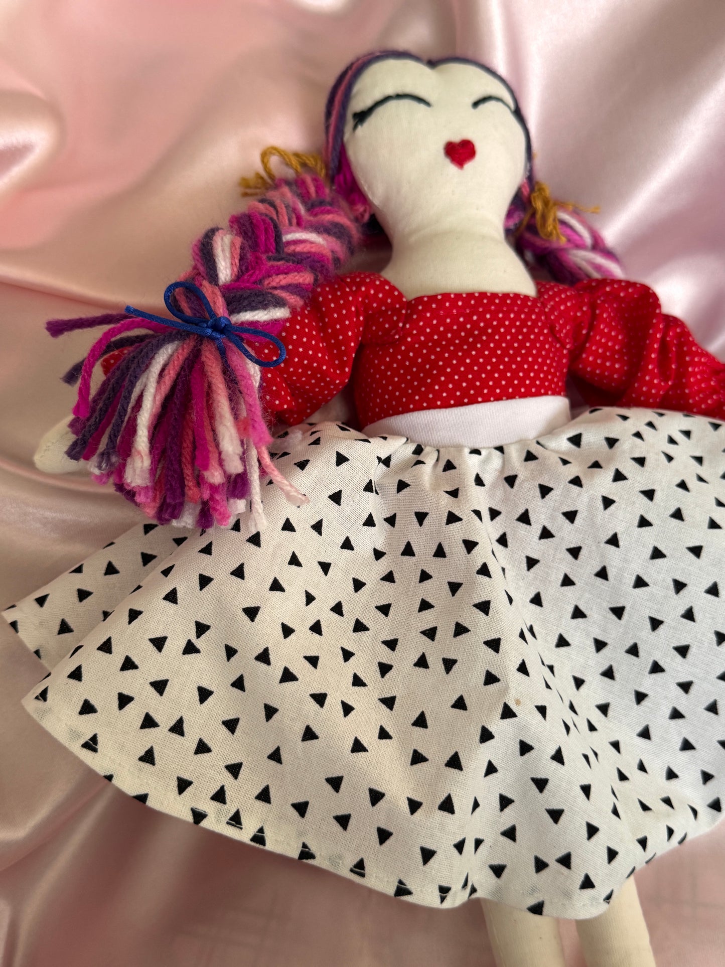 Handmade doll with a red dress 